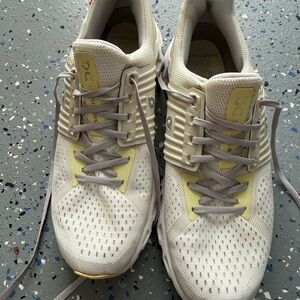 On Running Cream and White Sneakers